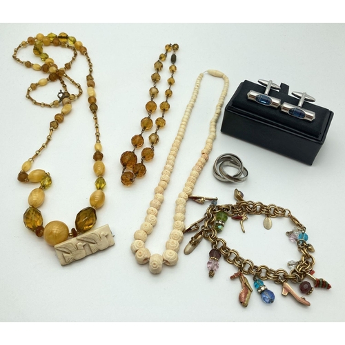 280 - A small collection of costume jewellery to include amber glass bead necklaces, charm bracelet, cuff ... 