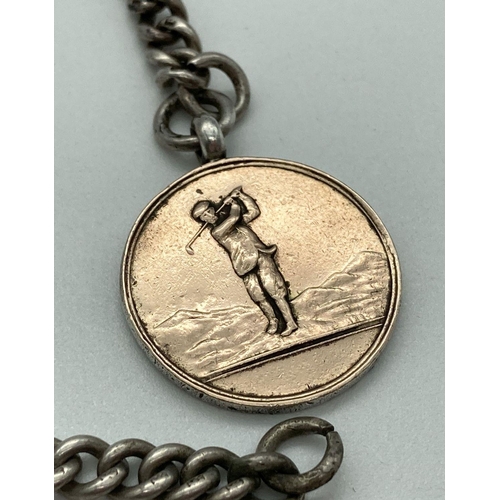 215 - A vintage silver golfing medal on a silver curb chain. Medal for 