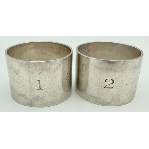 362 - A pair of heavy silver napkin rings, engraved with Home & Henderson Clan crests. Fully hallmarked Bi... 