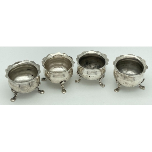 368 - A set of 4 Walker & Hall Victorian silver 3 footed salts with scalloped shaped rims. Of bulbous form... 