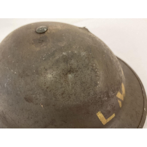 1039 - British MkII steel helmet painted khaki with stencilled 'LMS' (London Midland Scottish Railway). Let... 