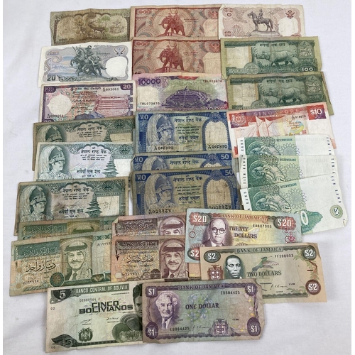 1004 - A collection of 29 assorted foreign bank notes. To include notes from: Nepal, Thailand, Singapore, S... 