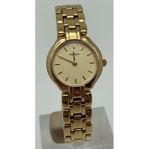 1054 - A ladies gold tone bracelet strap wristwatch by Tissot. Pale gold face with gold tone hour markers a... 