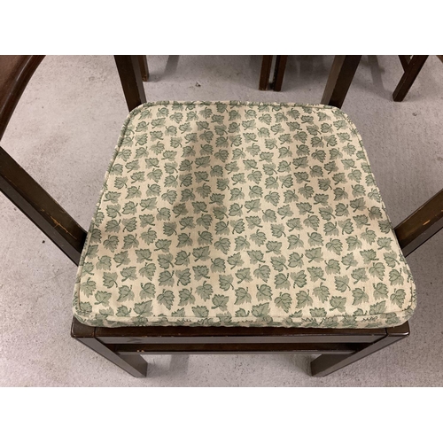 1383 - A set of 6 Ercol ladderback dining chairs, to include 2 carvers. All with matching green leaf seat p... 