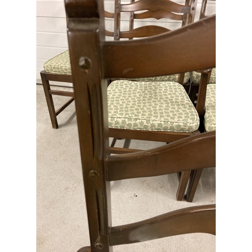 1383 - A set of 6 Ercol ladderback dining chairs, to include 2 carvers. All with matching green leaf seat p... 