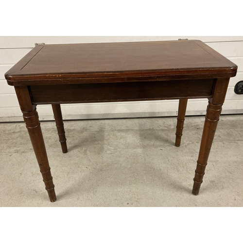 1392 - An Edwardian fold out mahogany table with pull out support legs to back revealing a hidden draw. Tan... 