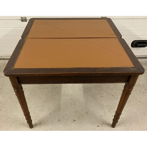 1392 - An Edwardian fold out mahogany table with pull out support legs to back revealing a hidden draw. Tan... 