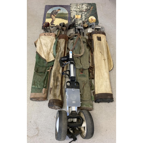 1255 - 4 vintage canvas pencil golf bags together with a quantity of assorted golf clubs, golf trolley & po... 