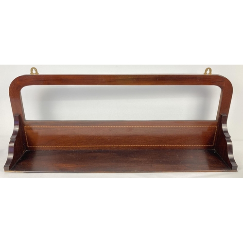 1394 - An Edwardian mahogany wall hanging shelf with shaped back and banded inlay decoration. Approx. 31 x ... 