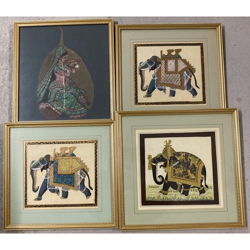 1218 - 3 Indian paintings on fabric of elephants together with a hand painted leaf. In matching gilt frames... 