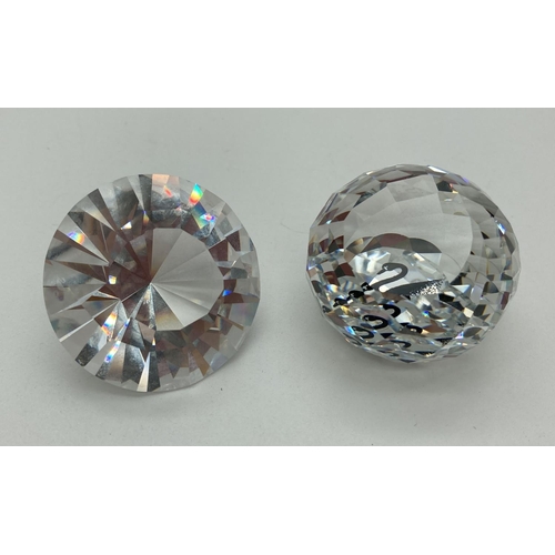 1201 - 2 Swarovski Crystal Society pieces. A boxed 2012 diamond renewal piece together with an unboxed Memb... 