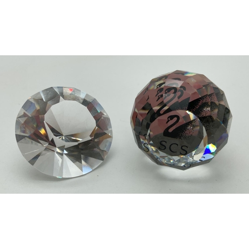 1201 - 2 Swarovski Crystal Society pieces. A boxed 2012 diamond renewal piece together with an unboxed Memb... 