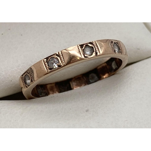 85 - A vintage 9ct gold full eternity ring set with clear stones. Ring size K. Marked 9ct to inside of ba... 