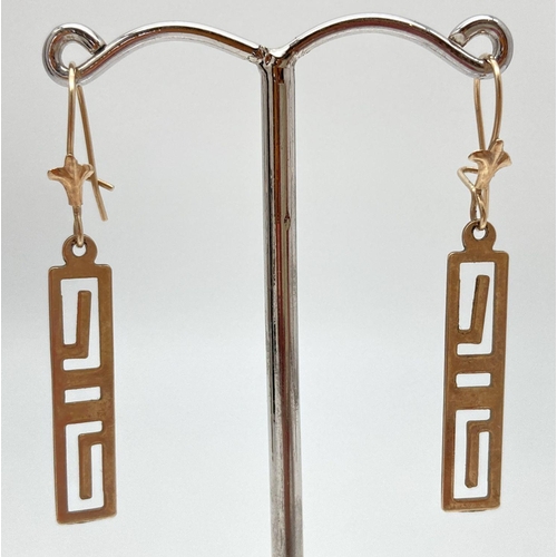 95 - A pair of gold drop style earrings with Greek Key design. Approx. 2.5cm long. Test as 9ct. Total wei... 