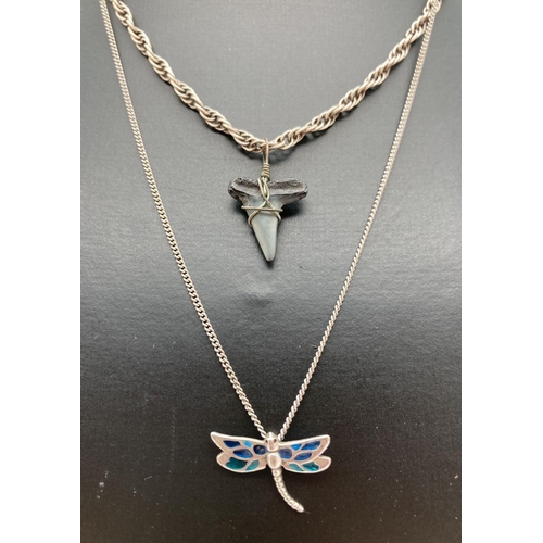 103 - 2 decorative pendants on silver chains. A small dragonfly with enamel set wings on an 18