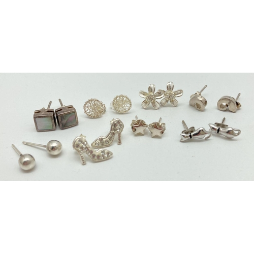 105 - 8 pairs of silver and white metal stud style earrings. To include: cats, crystal set shoes, stars, d... 