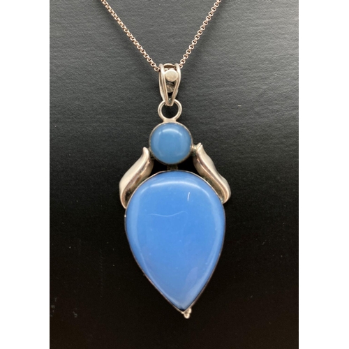 133 - A modern design silver pendant set with blue chalcedony on a 16 inch fine belcher chain with extensi... 