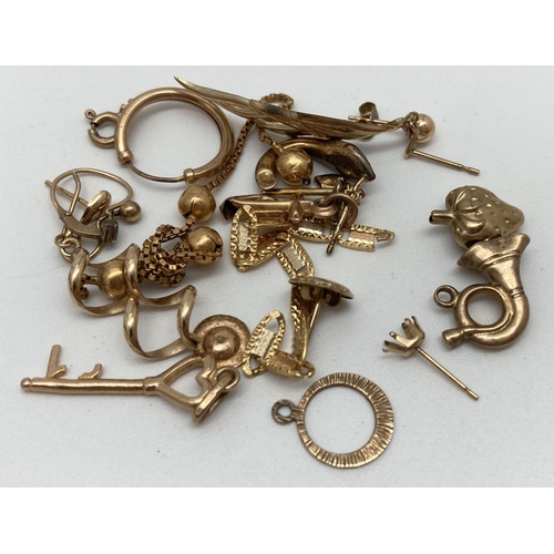 134 - A small quantity of scrap gold earrings, part chains and charms. All marked or test as 9ct gold. Tot... 