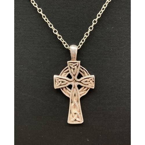 137 - A 925 silver Celtic design cross pendant on a 17 inch fine belcher chain with lobster style clasp. B... 