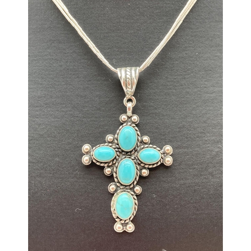 158 - A Quoc Turquoise set silver cross pendant on an 18 inch multi strand silver long bead chain by Carol... 