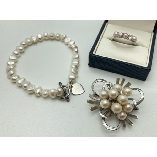 161 - 3 items of silver and pearl jewellery. A vintage floral spray brooch, a freshwater pearl bracelet wi... 