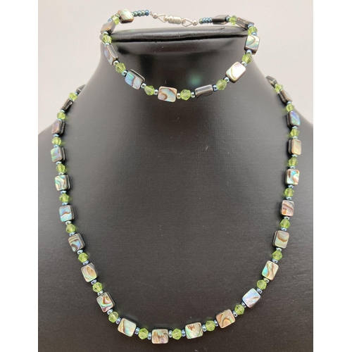 340 - A matching abalone and crystal beaded necklace and bracelet. Necklace approx. 18