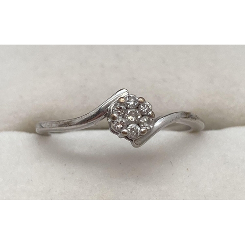 171 - A 9ct white gold twist setting ring with central diamond cluster, approx. .15ct. Fully hallmarked in... 