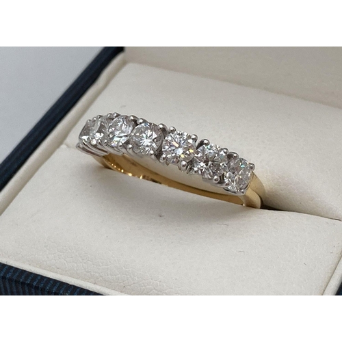 27 - An 18ct gold 1.45ct diamond half eternity style ring. Set with 7 round cut diamonds. Full hallmarks ... 