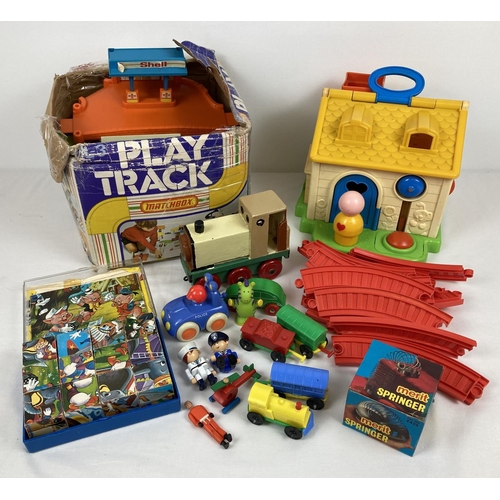 1231 - A collection of vintage toys to include a Fisher Price activity cottage (incomplete), a Matchbox Pla... 