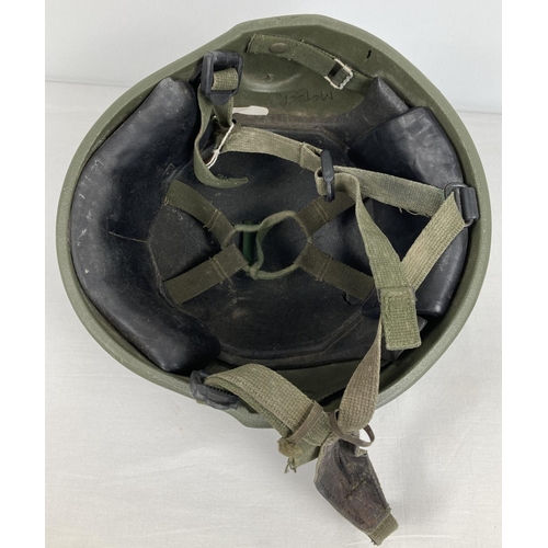 1114 - A British general service Mk6 ballistic nylon helmet, circa 1990. Complete with liner and 3-point ha... 