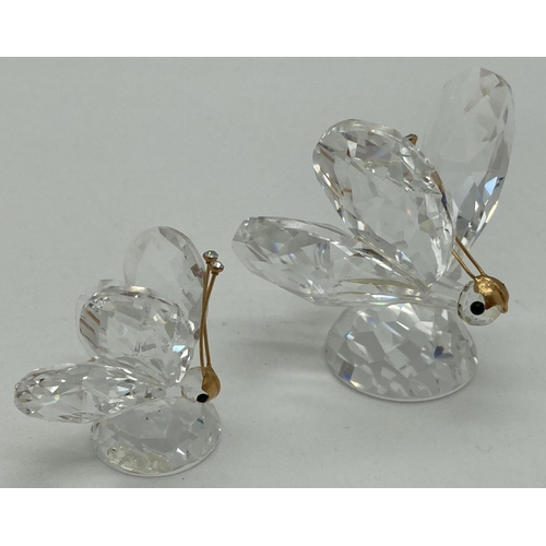 1184 - 2 Swarovski crystal butterflies with gold tone antennae. Both with swan mark, unboxed. Largest appro... 