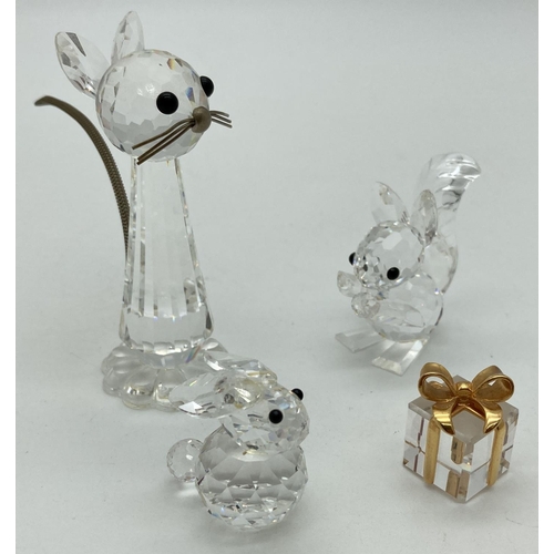 1185 - 3 unboxed Swarovski crystal animal figures. A tall cat with metal whiskers and chain tail, a squirre... 