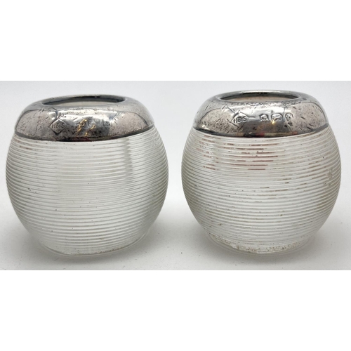 1034 - A pair of Edwardian ribbed glass, silver topped match strikers. Each hallmarked Birmingham 1902 with... 