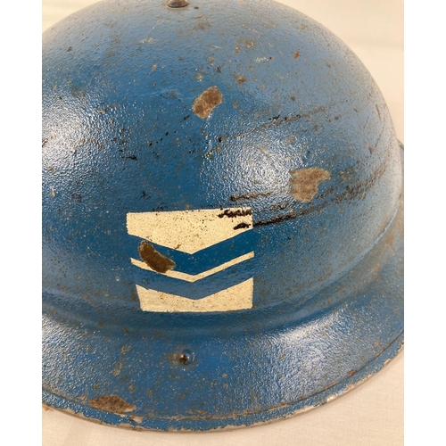 1120 - A WWII British Mk II steel helmet, painted blue. With red cross and rank marking for Corporal in RAF... 