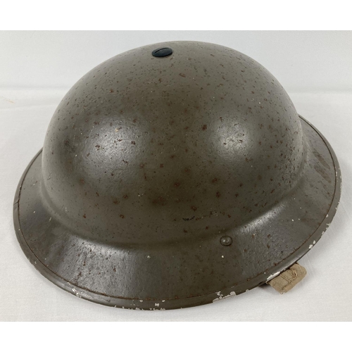 1122 - A WWII British Mk II steel helmet in excellent condition for age, with factory paint finish. Helmet ... 