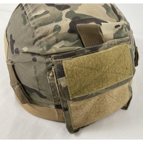 1123 - A British 1999 lightweight Paratroop helmet, size medium. With camouflage cover including Velcro pou... 