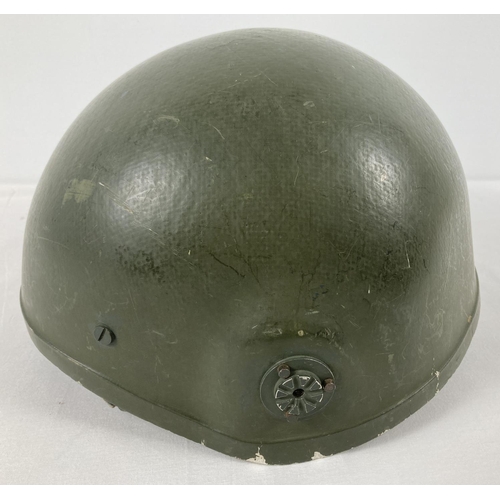 1124 - A British Northern Ireland pattern Combat helmet made of GRP by Thetford Moulded Products Ltd. 1971-... 