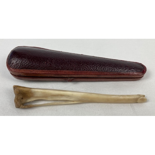 1292 - A vintage cheroot holder made from a animal fibula leg bone. Complete with period leather velvet lin... 