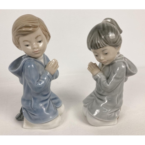 1144 - 2 Nao Spanish ceramic figurines of a boy and girl praying. 1985, tallest approx. 13.5cm tall.