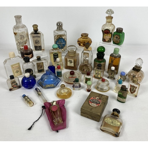 1259 - A collection of vintage perfume and smelling salt  bottles, some still with contents. To include Lot... 