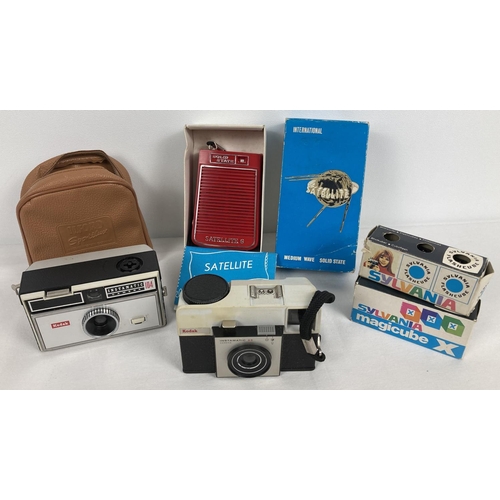 1301 - 2 vintage Kodak cameras together with a boxed Solid State Satellite transistor radio. Model 010, in ... 