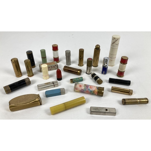 1270 - A collection of vintage lipsticks and lipstick holders in varying sizes and designs, some with conte... 