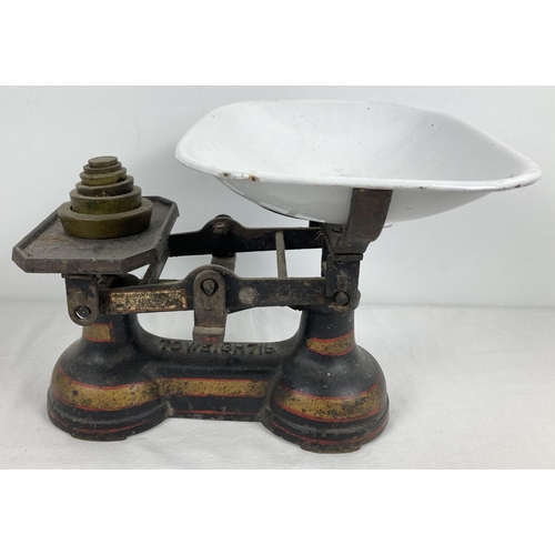 1088 - A set of vintage weighing scales by The Albion Foundry Ltd. With yellow and red painted detail. Comp... 