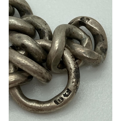 1067 - A vintage silver albert watch chain with lobster claw clasps. Both clasps marked and each curb chain... 