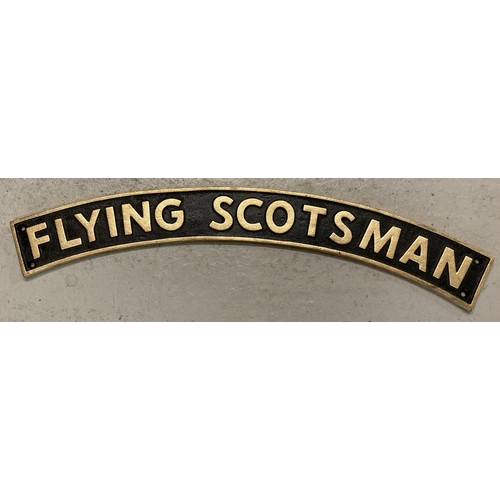 1101 - A large curve shaped cast metal Flying Scotsman wall hanging sign with fixing holes. In black and go... 