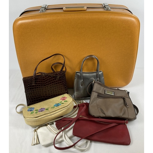 1280 - A vintage 1960's mustard coloured suitcase by Cheney. Check patterning fabric lining with interior e... 