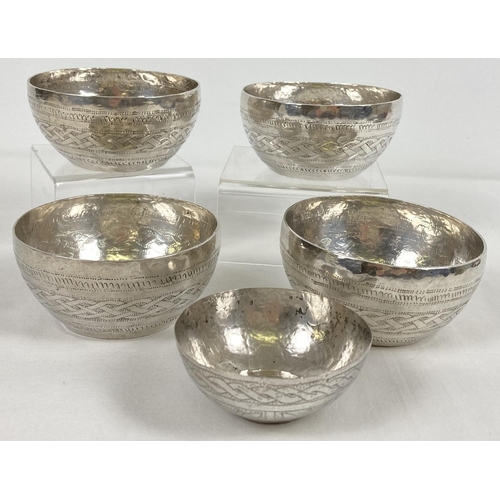 1070 - 5 vintage Anglo-Indian white metal bowls with hammered designs to outer bowl. A set of 4 matching bo... 