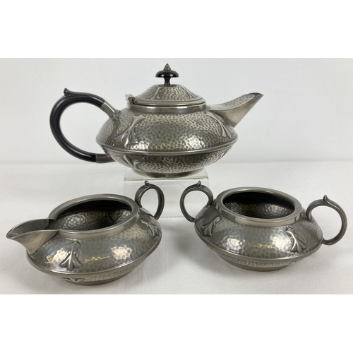 1315 - An antique Arts and Crafts pewter tea set by Civic, No. 3476. With hammered detail and trefoil style... 