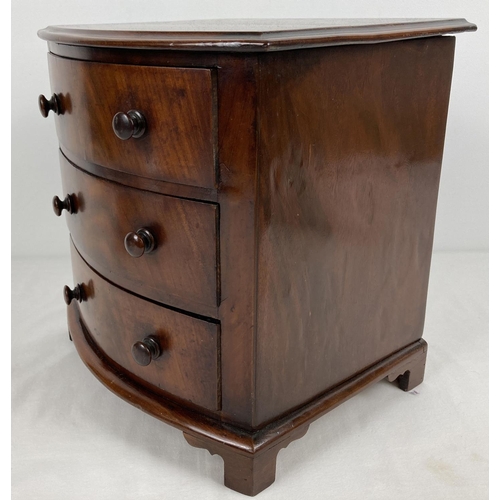 1316 - A vintage mahogany miniature bow fronted 3 drawer chest of drawers with bun handles and shaped feet.... 