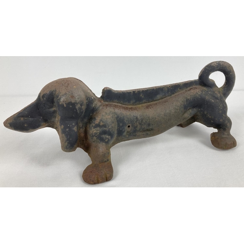 1103 - A vintage cast iron doorstop/boot scraper in the shape of a Dachshund dog. Approx. 33 x 10cm.